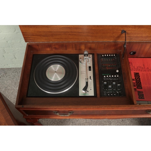 320 - A Dynatron walnut radiogram along with two matching speakers. Having Goldring G101 turntable.