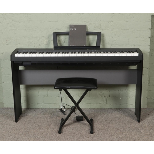 330 - A Yamaha P-35 Digital Piano, on stand with stool, with additional LP5A foot pedal. Complete with ins... 