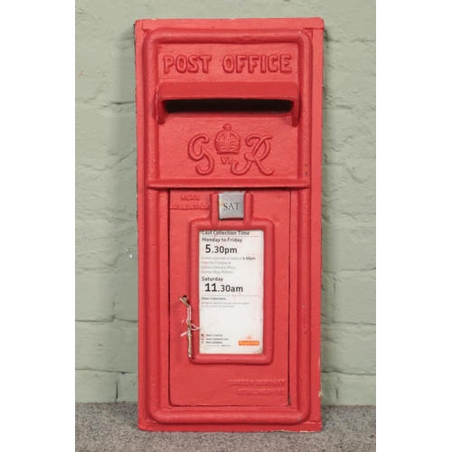 336 - A reproduction red painted post box front. Makers mark for Carron Company, Stirlingshire. 62.5cm x 2... 