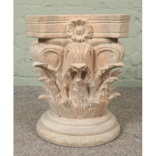 351 - An extensively carved wooden pedestal plinth, with turned stepped base. Height: 46cm, Width: 44cm.