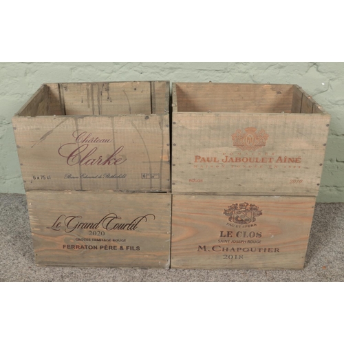 353 - Four wooden advertising wine crates. Includes Chateau Clarke, Paul Jaboulet Aine 2010, etc.