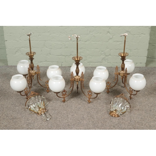 355 - Three matching brass three branch ceiling lights with milch glass shades along with two similar wall... 