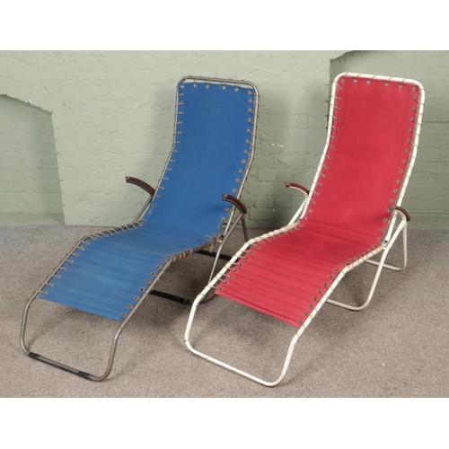 369 - Two vintage metal framed deck chairs.