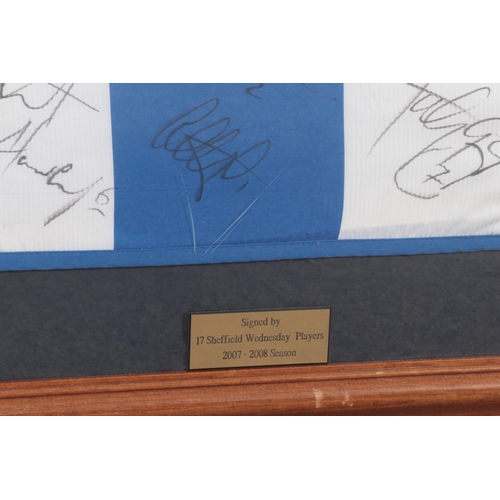 384 - A framed Diadora Sheffield Wednesday shirt from the 2007/2008 season, bearing seventeen players sign... 