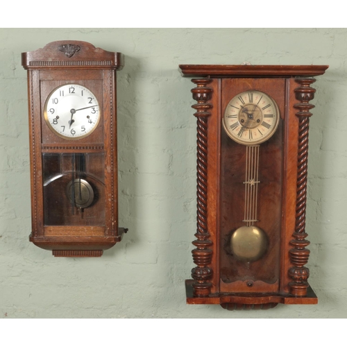 385 - Two wall clocks. Includes carved mahogany 8 day example, etc.