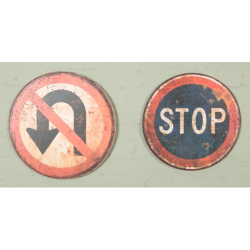 395 - Two metal road signs. Includes STOP and No U-Turns.