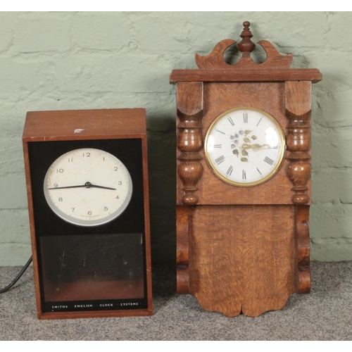 397 - Two wall clocks to include cased Smiths Electric example.