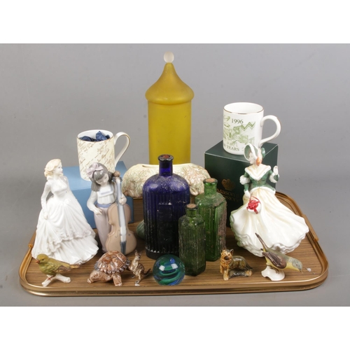 68 - A quantity of ceramics and glass. Includes Royal Doulton figures, Nao, glass poison bottles, lidded ... 