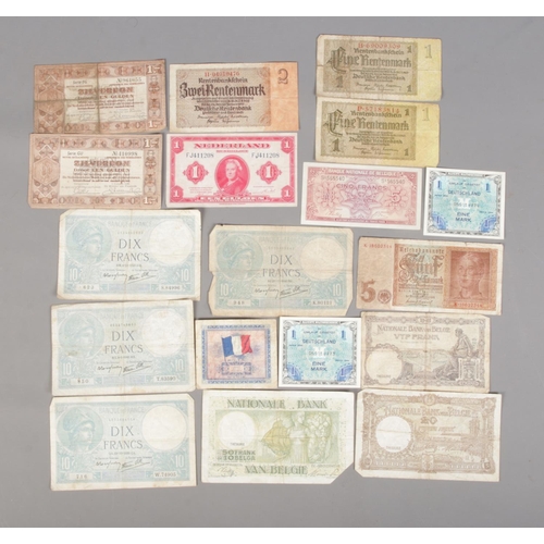 404 - A collection of European banknotes dating between 1937 and 1944 to include Banque Nationale De Belgi... 