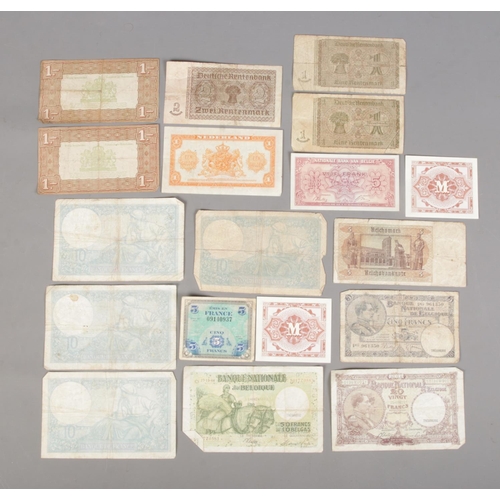 404 - A collection of European banknotes dating between 1937 and 1944 to include Banque Nationale De Belgi... 