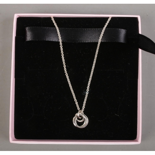 457 - A boxed silver Pandora pendant on chain along with a boxed silver Pandora ring. With original bag.