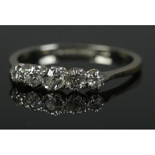 462 - A platinum five stone diamond ring. Size N, 1.8g.