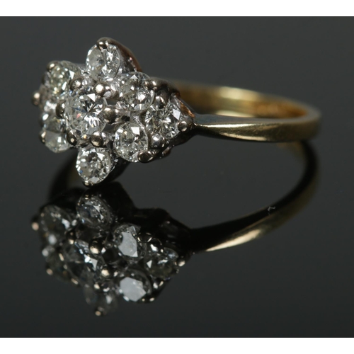 464 - An 18ct gold nine stone diamond cluster ring, approx. .5 carats total. Size K, 2.5g.