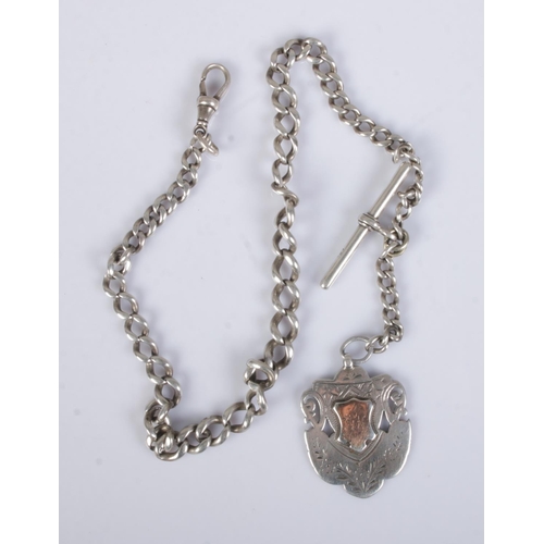 468 - A Victorian silver albert chain with silver fob. Hallmarked for Birmingham 1892 by William Walter Ca... 