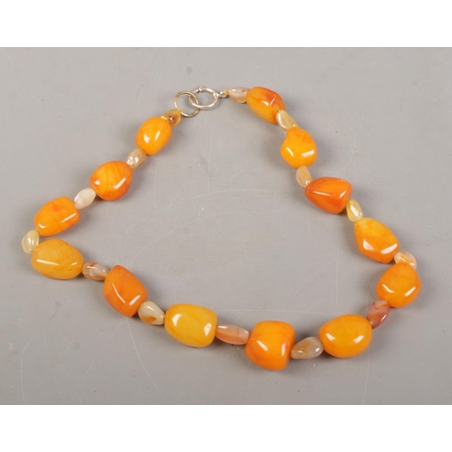 478 - A large polished Agate bead necklace. Length 65cm.