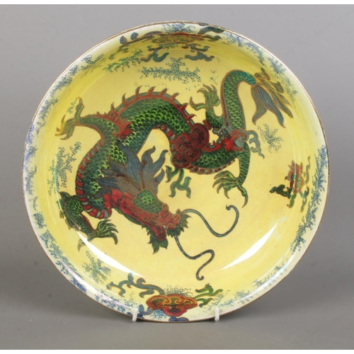 80 - A Bursley Ware 'Dragon' ceramic bowl, decorated with central dragon motif, gilt highlights and folia... 