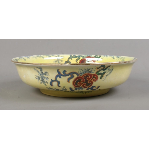 80 - A Bursley Ware 'Dragon' ceramic bowl, decorated with central dragon motif, gilt highlights and folia... 