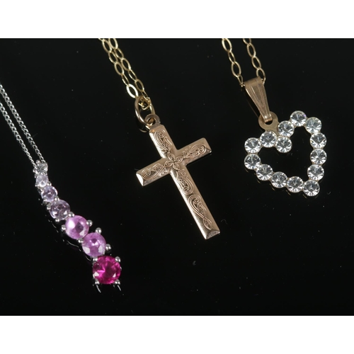 488 - Three 9ct gold necklaces to include crucifix and white gold and sapphire examples. Total weight 2.34... 