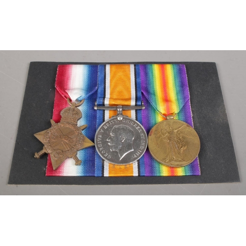 492 - A WWI trio of medals, awarded to Corporal Lieutenant Joseph Burns, 11497, Manchester Regiment. With ... 