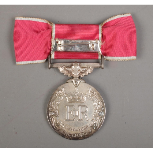 494 - A Queen Elizabeth II British Empire Medal with ladies ribbon bow, displayed in case of issue. Issued... 