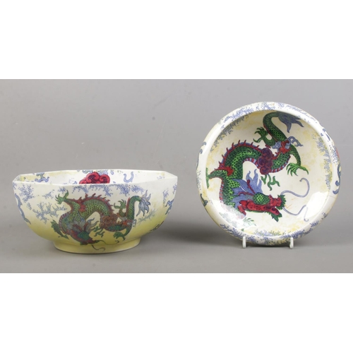 86 - Two pieces of Bursley Ware ceramics in the 'Dragon' design, with yellow lustre glaze, dragon motif a... 