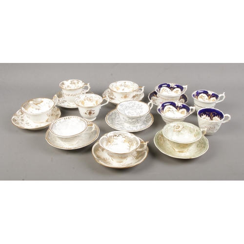 505 - A collection of 19th century Rockingham porcelain teawares. All bearing puce griffin mark.