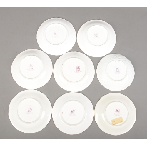 505 - A collection of 19th century Rockingham porcelain teawares. All bearing puce griffin mark.