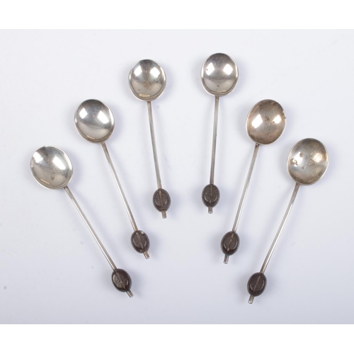 509 - A cased set of six silver demitasse spoons with coffee bean finials. Assayed for Birmingham, 1933 by... 