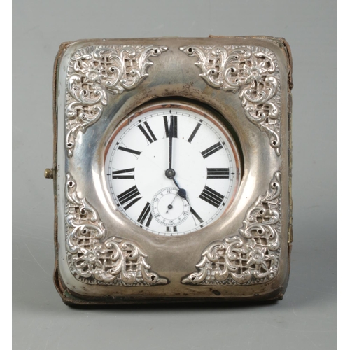 510 - A white metal cased goliath open face pocket watch in a silver mounted watch case with easel back. T... 