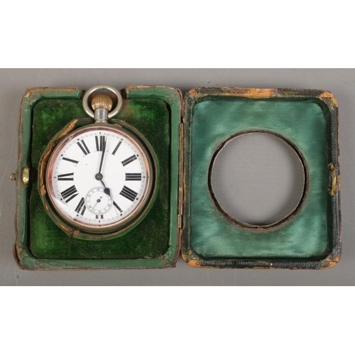 510 - A white metal cased goliath open face pocket watch in a silver mounted watch case with easel back. T... 