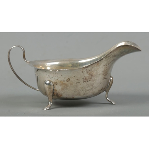 519 - A George VI silver cream boat, raised on three feet. Assayed for Sheffield, 1939 by Viner's Ltd (Emi... 