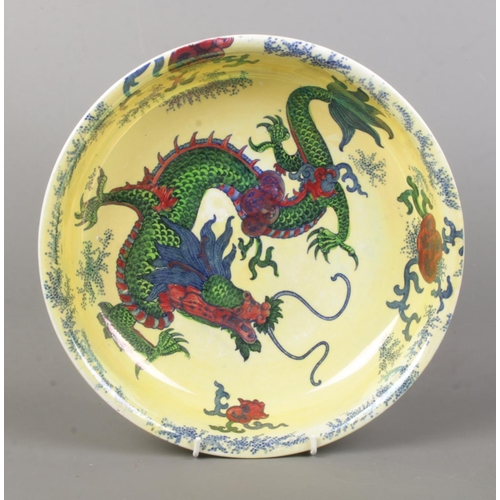 88 - A Bursley Ware 'Dragon' ceramic bowl, decorated with central dragon motif, blue dotted rim and folia... 