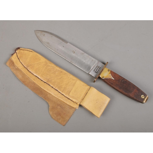 96 - A John Nowill bowie knife with scabbard. Length of blade 20cm. CANNOT POST OVERSEAS.