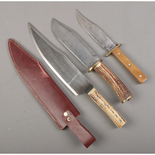 97 - Three knives. Includes horn handle bowie knife example, etc. CANNOT POST OVERSEAS.