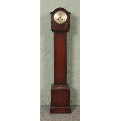 538 - An oak Granddaughter clock with barley twist columns and stepped plinth base.

Hx133cm