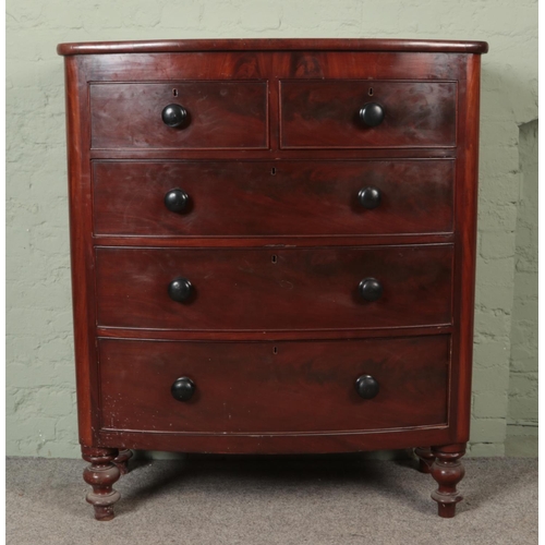 539 - A Victorian mahogany bow front chest of drawers with two short over three long drawers, raised on bu... 