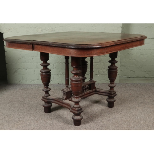 541 - A French oak extending dining table with turned supports and shaped stretchers.

Hx78cm
Wx116cm
Dx10... 