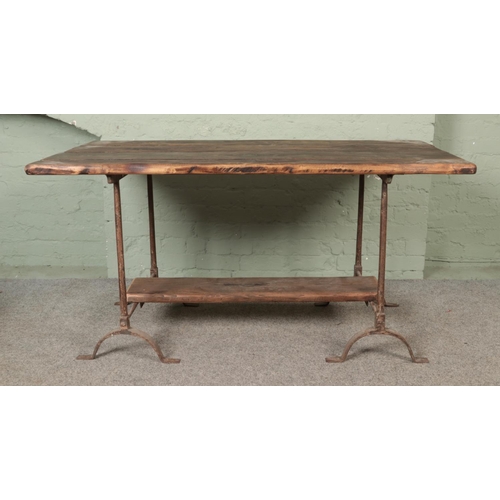 542 - A chunky pine plank top trestle table with cast iron base.

Hx77cm
Wx153cm
Dx77cm