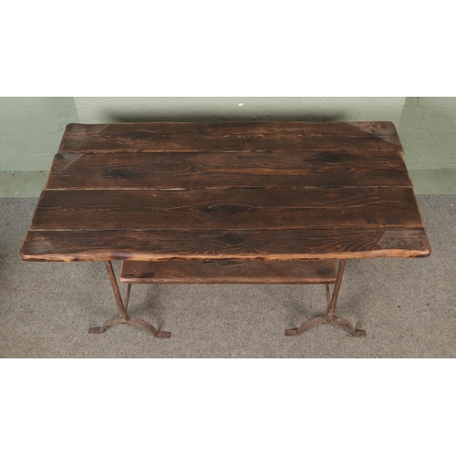 542 - A chunky pine plank top trestle table with cast iron base.

Hx77cm
Wx153cm
Dx77cm