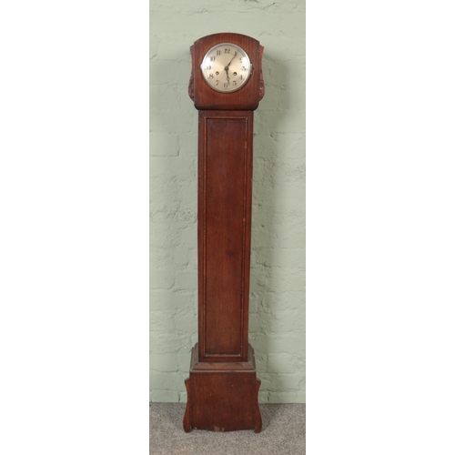 550 - An oak Granddaughter clock with stepped plinth base.