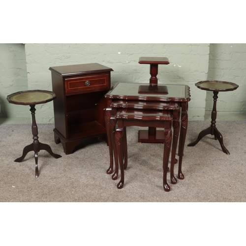 588 - A quantity of assorted occasional furniture, to include a nest of three tables, a pair of wine table... 