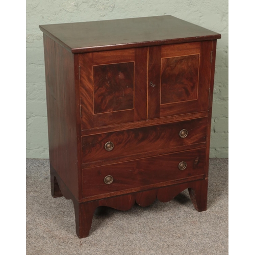 591 - An inlaid mahogany bedside cupboard.

Hx78cm
Wx61cm
Dx43cm