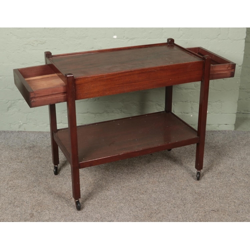 593 - A mahogany tea trolley with drawer to either side.

Hx73cm
Wx77cm
Dx42cm