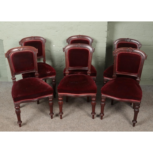 596 - A set of six Victorian chairs with red upholstery.