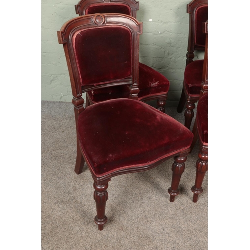 596 - A set of six Victorian chairs with red upholstery.