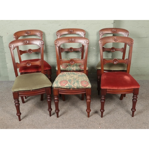 601 - A set of six mahogany carved dining chairs.