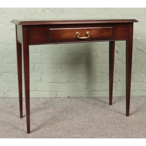 616 - A mahogany console table, with lower drawer and drop down handle. Height: 74cm, Width: 83cm, Depth: ... 