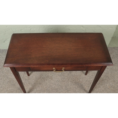 616 - A mahogany console table, with lower drawer and drop down handle. Height: 74cm, Width: 83cm, Depth: ... 