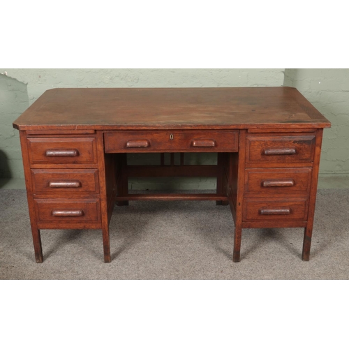 618 - A 1930's oak double pedestal desk, bears label for Crusader Modern Office Furniture, London.

Hx78cm... 