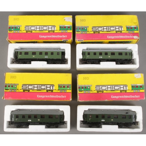 108 - Four boxed Schicht HO gauge model railway carriages.